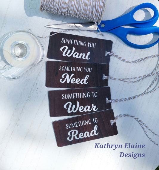 4 gift tags in wood grain with white lettering reading something you want, something you need, something to wear, something to read on white background